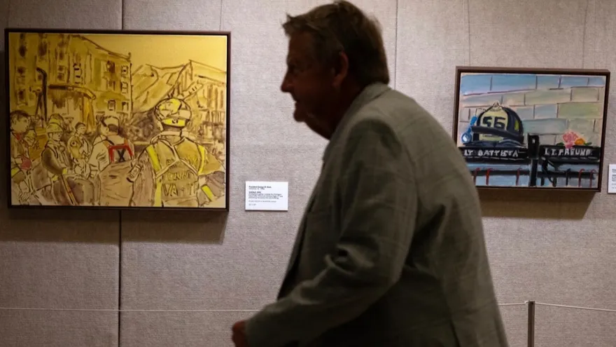 A visitor looks at paintings by former US President George W. Bush at the George W. Bush Presidential Museum in Dallas, Texas, on September 9, 2026.