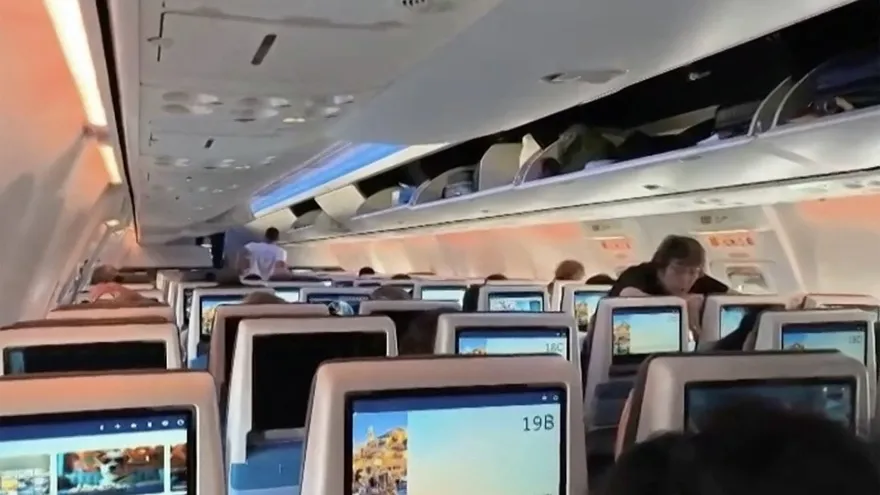 screengrab taken from a handout video footage via AFPTV on September 30, 2026 shows passengers inside the rerouted flydubai flight FZ 1073