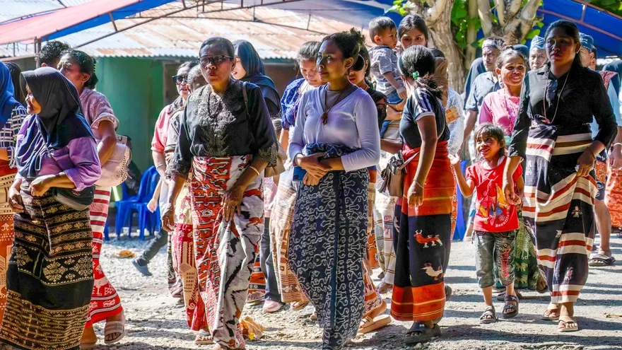 Sumbanese women wearing ikat fabric attending a marapu funeral ceremony