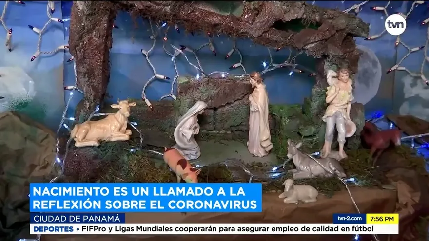 Familia conjuga en su nacimiento a la navidad con el coronavirus